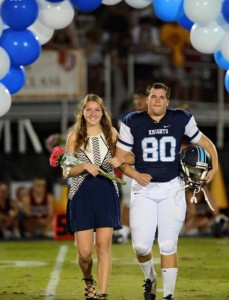 Seniors Cater Carlton and Samuel Sloman walk across Walsh Field during halftime at Walsh Field. Photo Credit: Cater Carlton