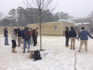 Sophomores threw snowballs, made snow angels, and shoved the ice down each other's shirts as the snow started to stick to the grass. Photo: Dean Papastrat