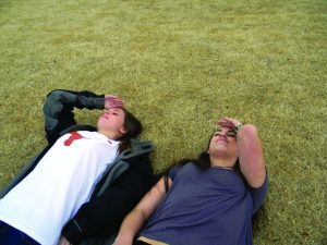 Seniors Mary Liles Fiveash and Olivia Levine practice tanning on the lawn for spring break. Photo: Wylie Heiner