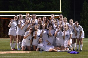 The girls soccer team celebrates after beating HIES in the Elite Eight of the state tournament. Photo: Fred Assaf