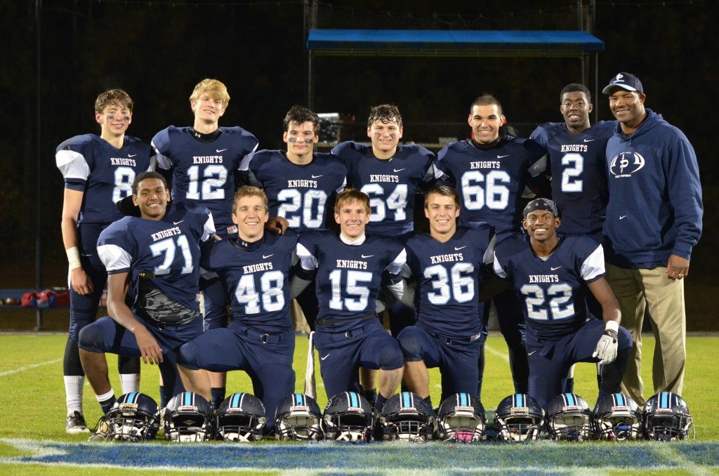 Senior football players, Class of 2014, are all smiles after their win over Mt. Vernon last year. Photo: Fred Assaf