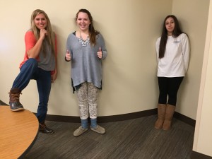 Seniors Caroline Denny and Kate Mullally show off their winter footwear while avoiding the infected senior Morgan Baker. Photo: Grace Francour