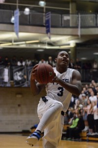 Senior guard Kevin Johnson emphatically attacks the rim against the Lamar County Trojans. Photo by Fred Assaf.