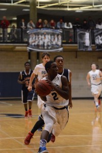 Sophomore guard Mark Sommerville goes up for a layup against Lamar County guard Tre Lumpkin. Photo by Fred Assaf