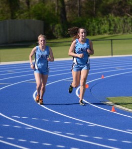 Seniors Katie Nelson and Hannah Kelly race to finish line in the first ever track meet at Walsh Field. Photo: Fred Assaf