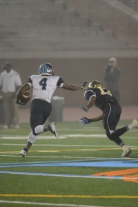 Junior running back Deon Jackson stiff-arms a B.E.S.T. defender on a run to the outside. Jackson finished with 174 rushing yards on the night. Photo Credit: Fred Assaf