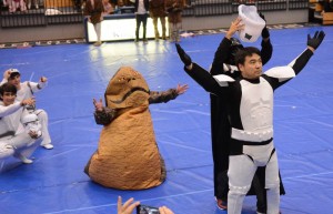 Junior Brian Sloan, who played Darth Vader in the juniors' spirit week skit, lifts the helmet off of a Storm Trooper, revealing junior dean Mr. Hatori. Photo: Fred Assaf
