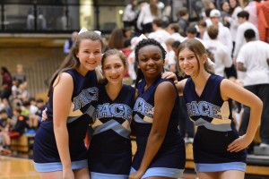 Freshmen Kendall Willis, Allison Reish, Alex Allen, and sophomore Anna Stone cheer on the Varsity Basketball team. Photo Credit: Fred Assaf