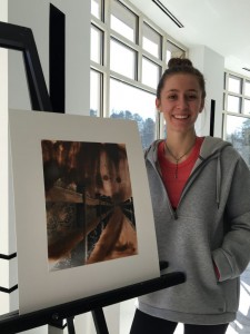Senior Elizabeth Hawn showing off her favorite photography piece. Photo: Amy Butler