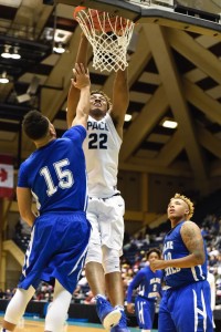 Junior Wendell Carter Jr. (#22) throws down a dunk over a Manchester player. Photo: Fred Assaf