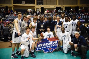 The Pace Academy Boys' Basketball team celebrates with the trophy after their state championship win in Macon. Photo: Fred Assaf