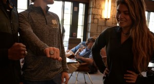 Junior Libby Sams is left awe struck by the football players' rings as they flaunt them in the Commons. Photo: Sloan Wyatt