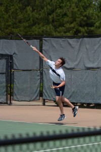 Junior Josh Nash hits a powerful serve. Photo: Fred Assaf