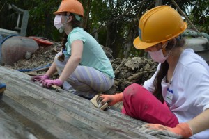Junior Emma Downey and Senior Tory Dancu work hard on the build site in My Tho. Photo: Caitlin Jones