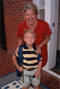 A young Joe Loughran poses with former LS Principal Anna Valerius on his first day of school, 2004. Photo: Joe Loughran