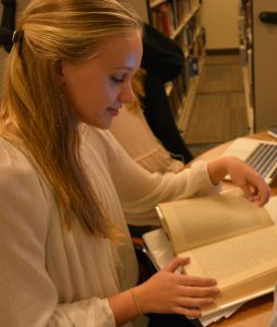 Sophomore Paige Fleming reads her favorite book.