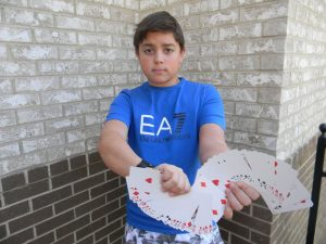 Freshman Jason Rosenbloum is quickly mastering close-up card tricks. Photo: Margaret Bethel