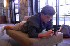 Junior Graeme Davidson spends his free time on his phone. Photo: Anna Stone