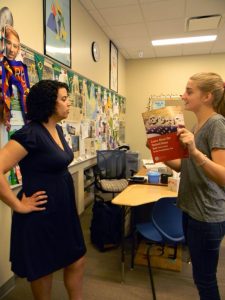 Junior Khaki Loughran quizzes Dr. Paula Pontes on citizenship test questions. Photo: Sydnie Jiang
