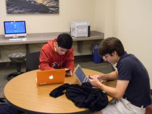Juniors playing on their phones for a quick study break.