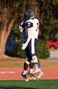 Deon Jackson (#4) and Jordan Payne (#7) celebrate in the end zone after a Deon touchdown. Photo: Fred Assaf